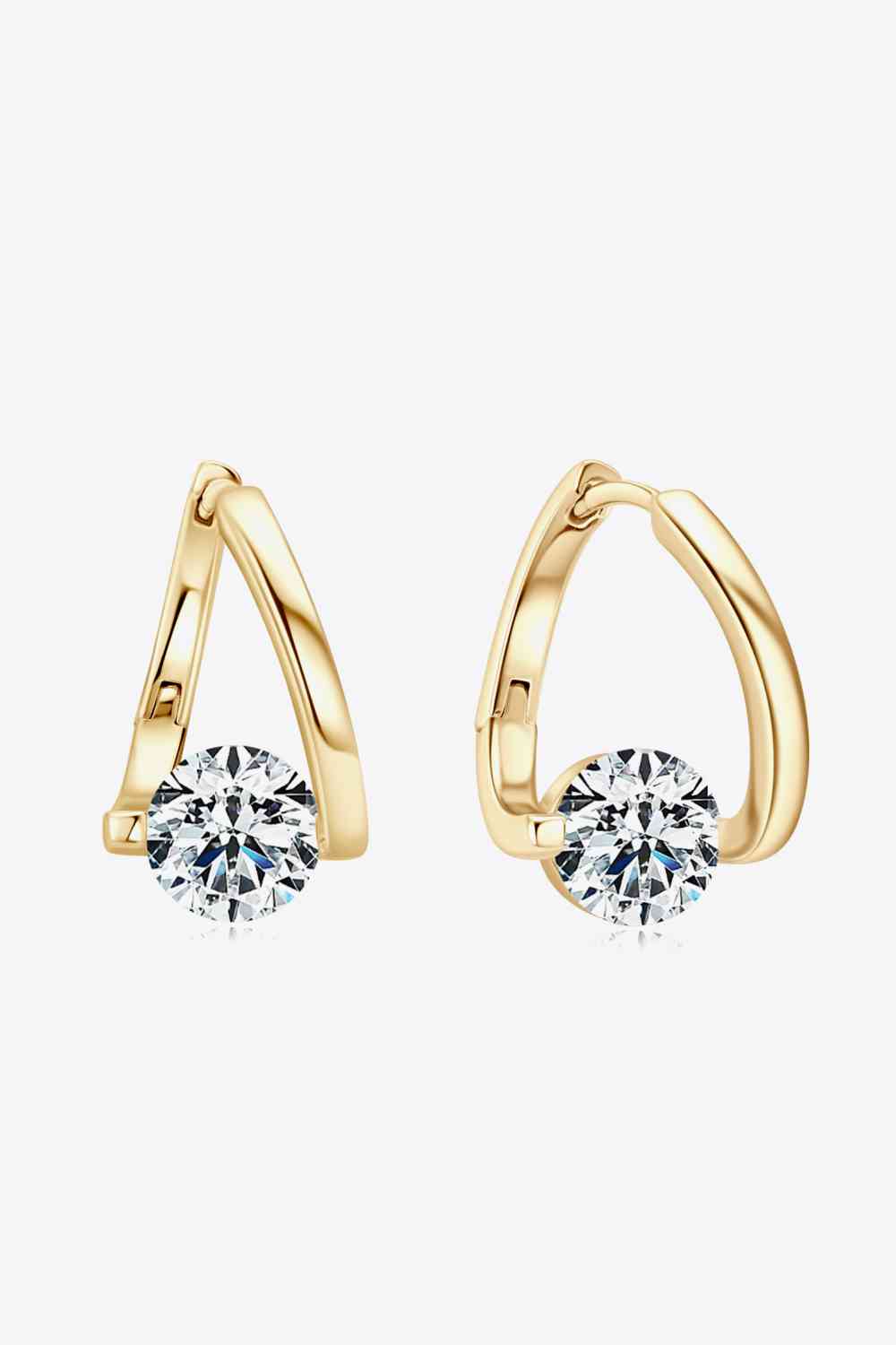 a pair of gold earrings with a diamond