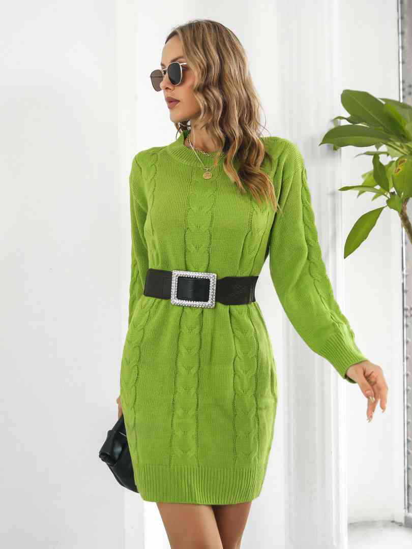 a woman in a green sweater dress