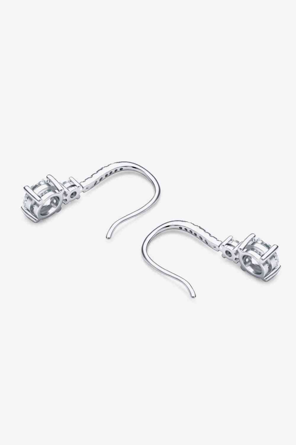 a pair of metal hooks on a white background