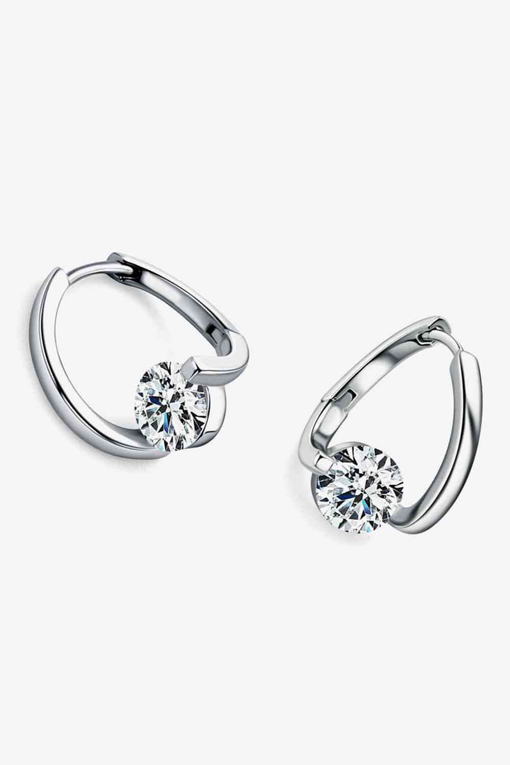 a pair of silver rings with a diamond