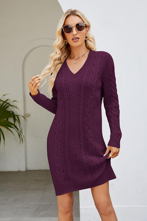 a woman wearing a purple sweater dress