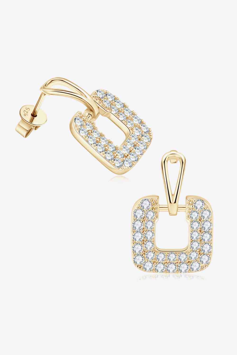 a pair of earrings with a square design