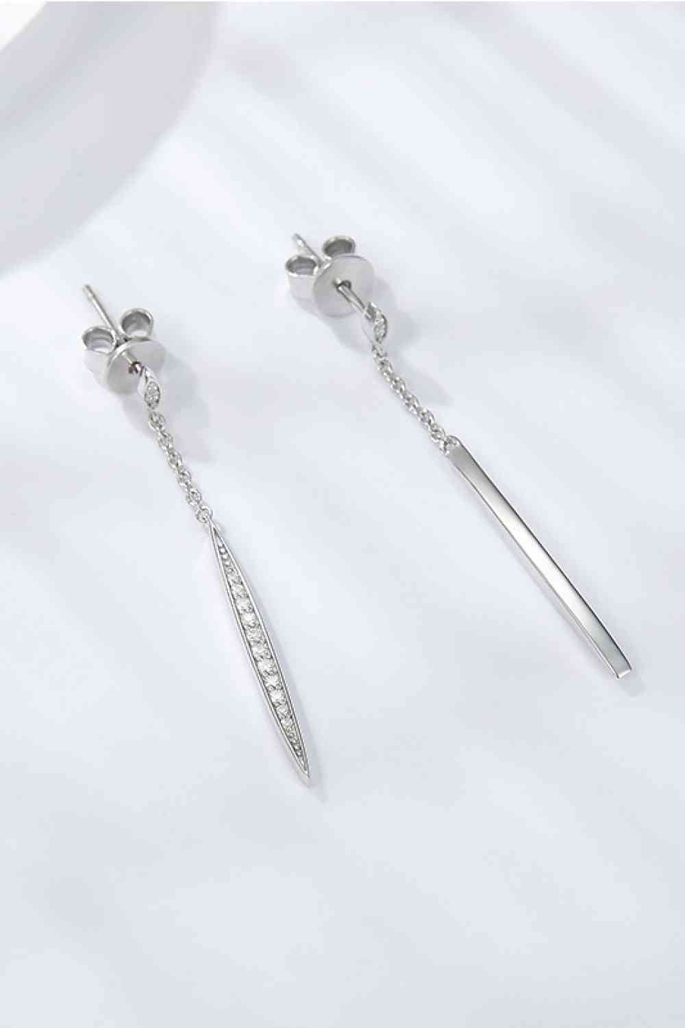 a pair of earrings with a bar and a chain hanging from it