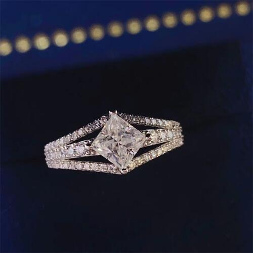 a ring with a princess cut diamond on it