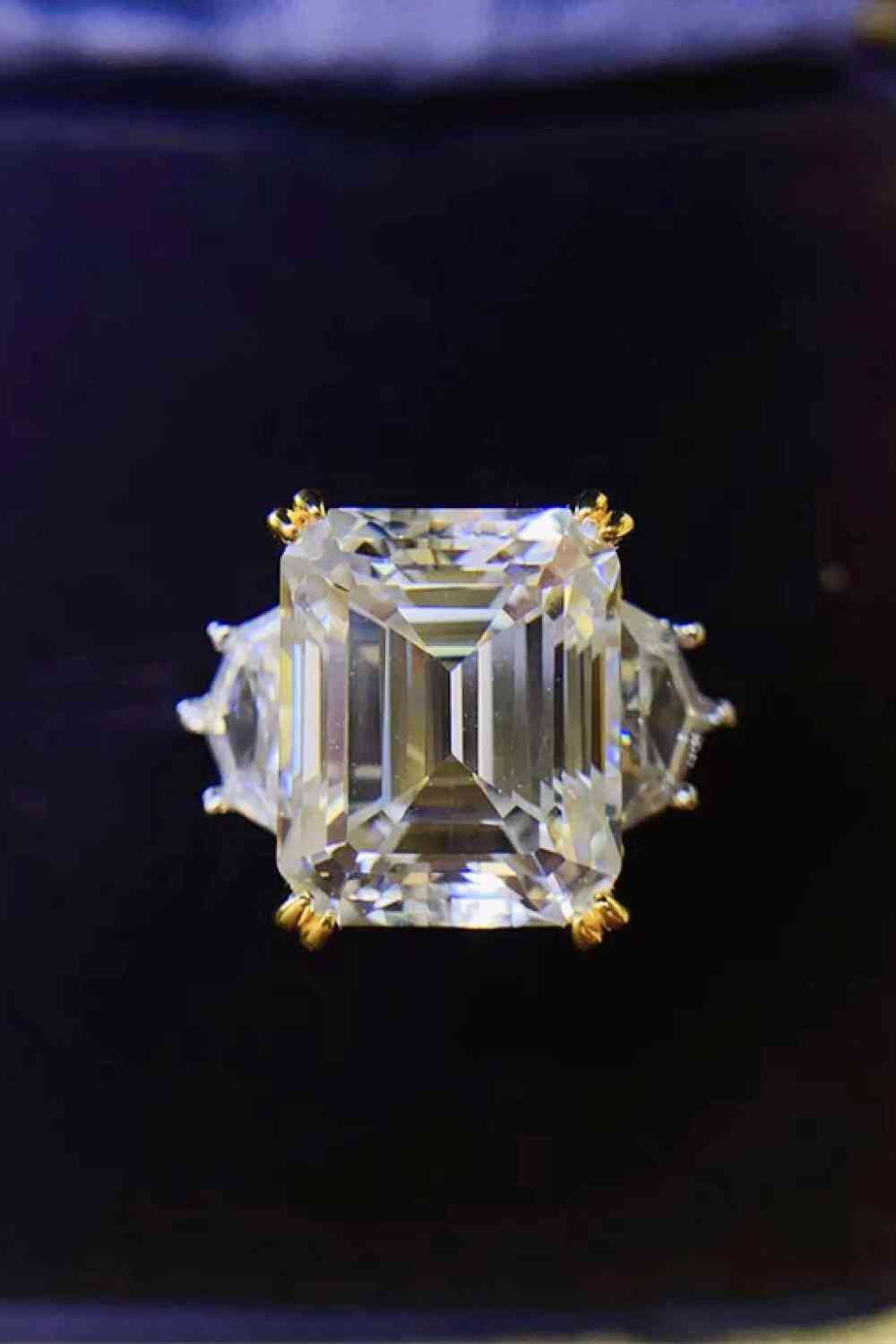 a fancy ring with an emerald cut diamond