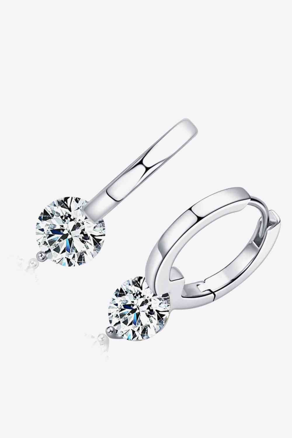 a pair of white gold diamond earrings