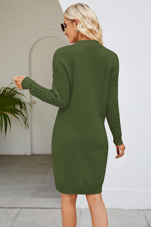 a woman in a green sweater dress