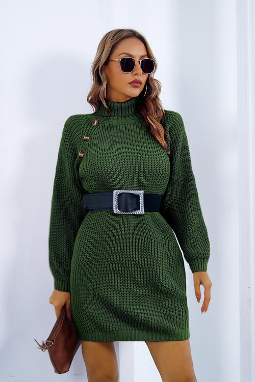 a woman wearing a green sweater dress and sunglasses