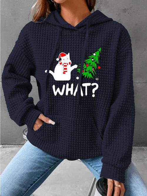a woman wearing a blue sweater with a snowman on it