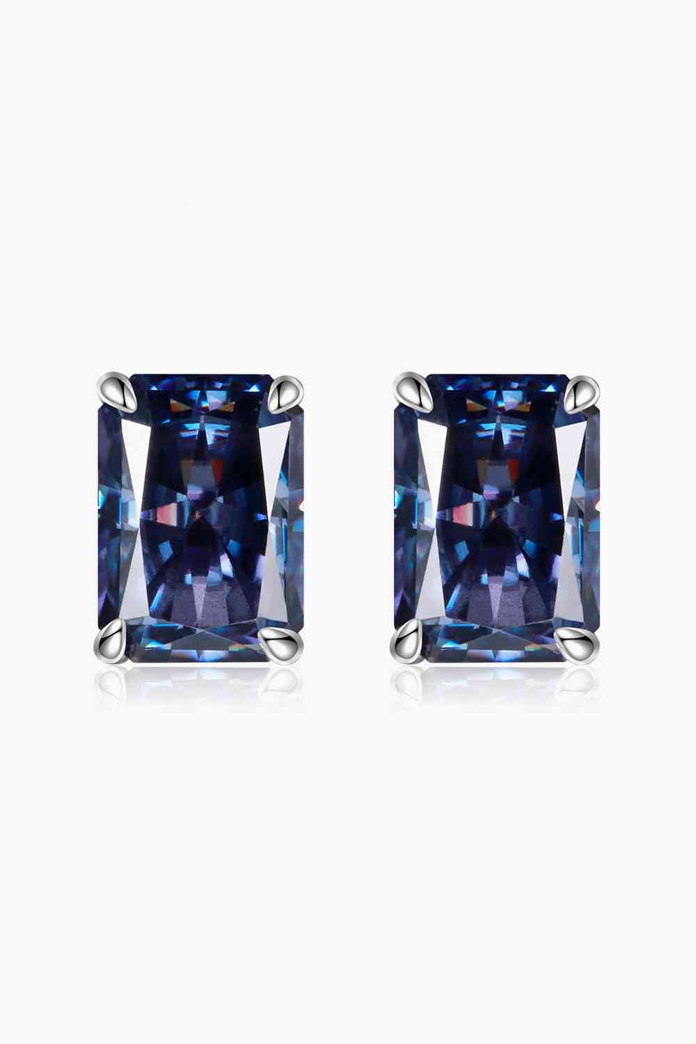 a pair of earrings with a square blue stone