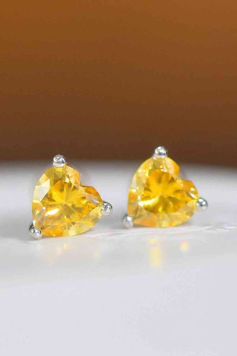 a pair of yellow diamond earrings