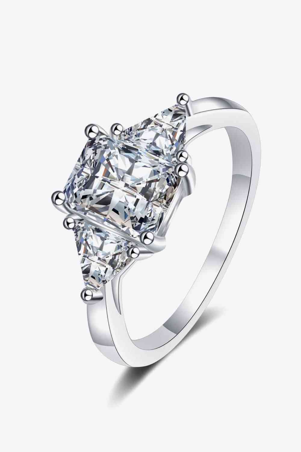 a ring with a princess cut diamond in the center