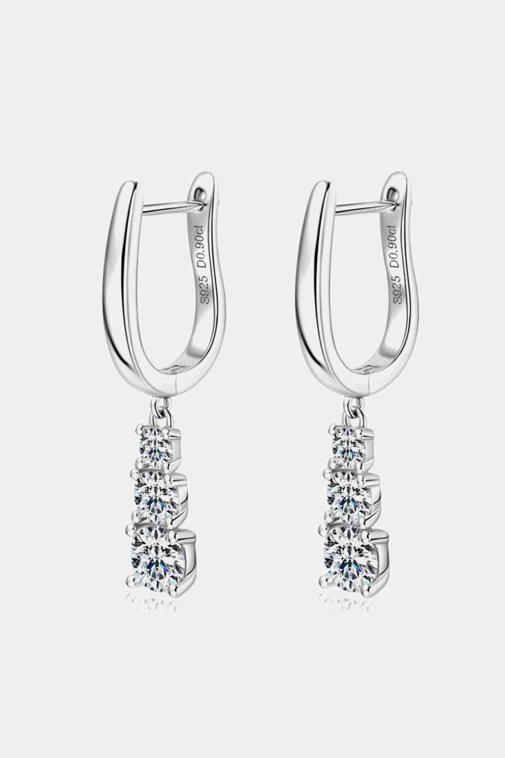 a pair of silver hoop earrings with crystal stones