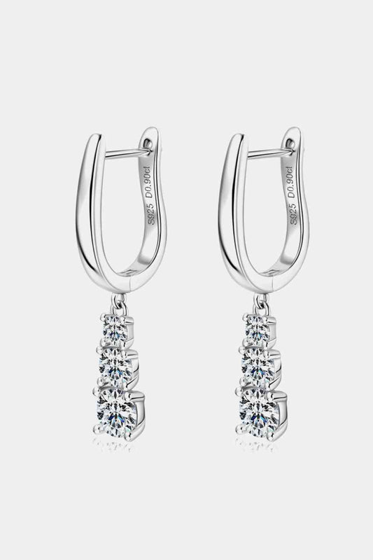 a pair of silver hoop earrings with crystal stones
