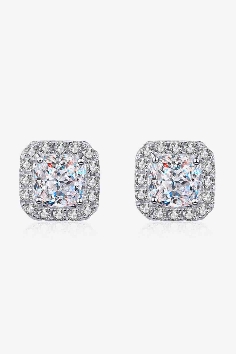 a pair of square shaped diamond earrings